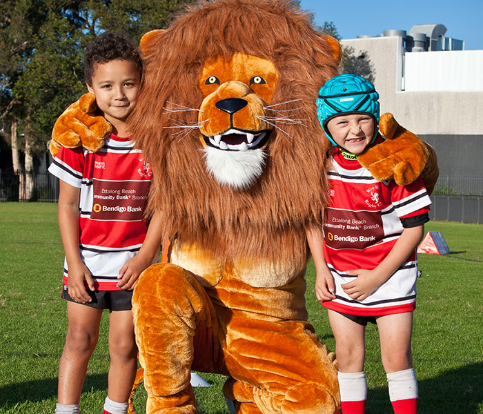 A Junior Woy Woy Rugby players with the lions supporter